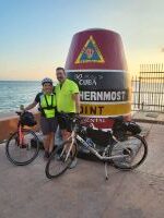 pic of couple with bicycles at the buoy in key west